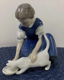 Girl Feeding her Cat