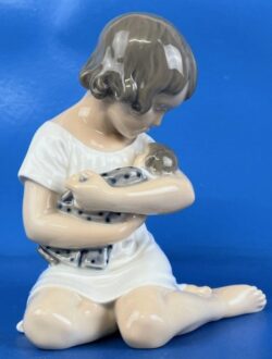 Girl Holding her Doll